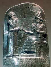 Detail of the stela inscribed with the Code of Hammurabi showing the king before the god Shamash, bas-relief from Susa, 18th century bc; in the Louvre, Paris.
